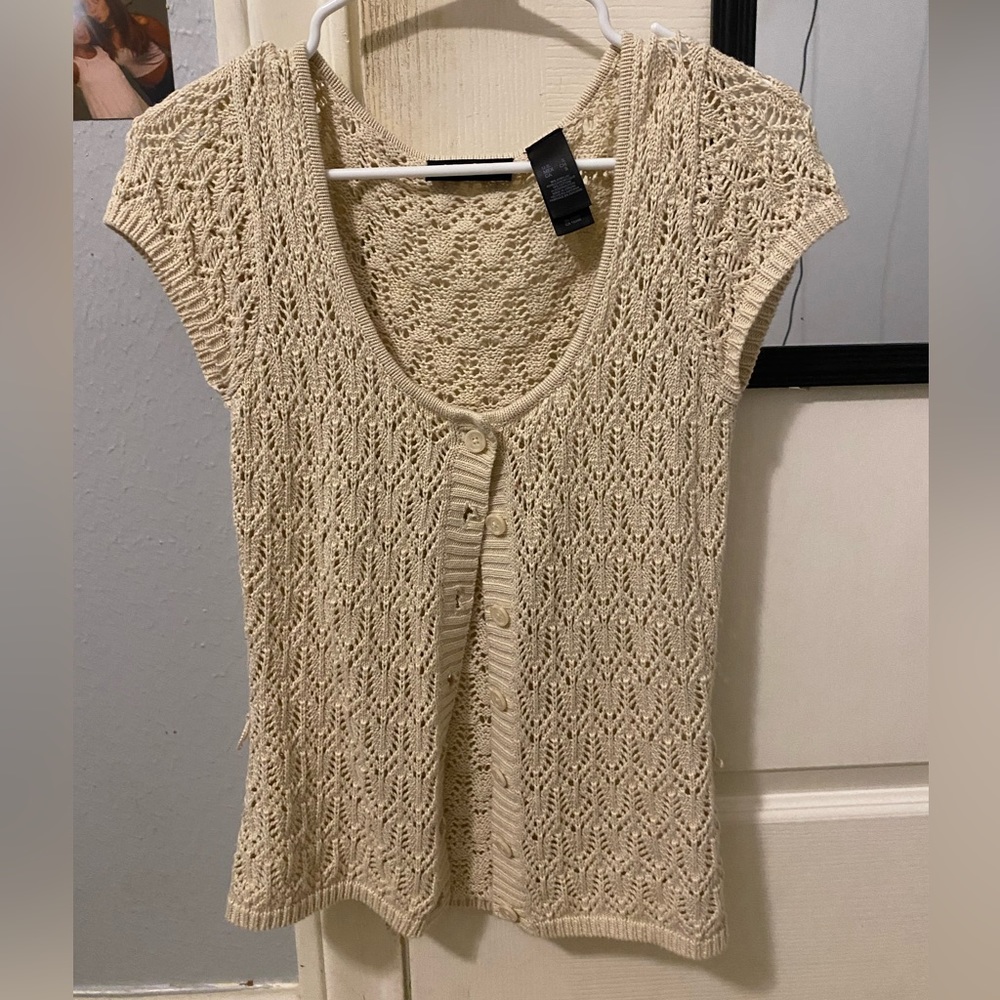 cream colored knit blouse